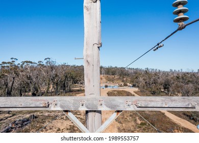 Drone Aerial Photograph Of A Telephone Pole And Wires In A Forest Affected By Bushfires