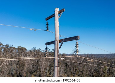 Drone Aerial Photograph Of A Telephone Pole And Wires In A Forest Affected By Bushfires