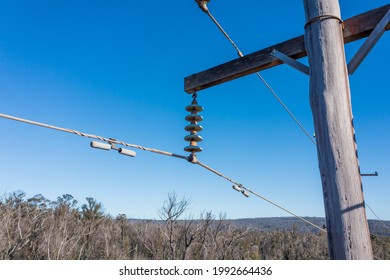 Drone Aerial Photograph Of A Telephone Pole And Wires In A Forest Affected By Bushfires