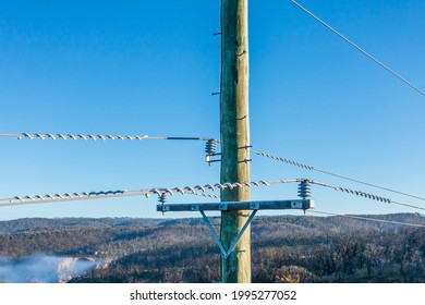 Drone Aerial Photograph Of A Telephone Pole And Wires In A Forest Affected By Bushfires