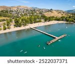 A drone aerial point of view landscape of Kalamalka Lake beach located in the Okanagan Valley near Vernon in the city of Coldstream, British Columbia, Canada. 