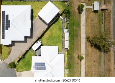 Drone Aerial Of Suburban Homes Beside A Public Walkway