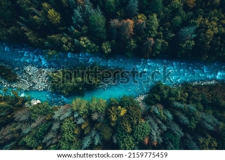 Drone aerial top view of mountain river and forest