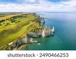 The drone aerial view of the beautiful white cliffs of Etretat, Normandy, France, La Manche or English Channel.