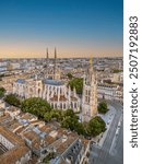 The drone aerial view of Bordeaux Cathedral and Pey Berland Tower at sunrise, Bordeaux, France.