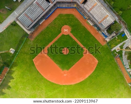 Drone Aerial View flying above a outdoor Baseball Field Diamond.