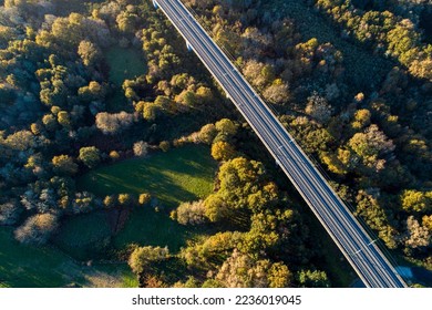 drone aerial view of a high speed train line on viaduct at sunset - Powered by Shutterstock