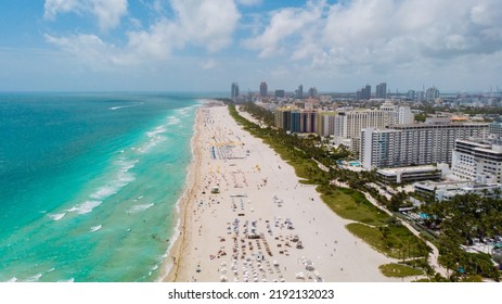 Drone Aerial View At Miami South Beach Florida. Beach With Colorful Chairs And Umbrellas, Top View Of The Beach Miami Florida