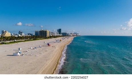 Drone Aerial View At Miami South Beach Florida. Beach With Colorful Chairs And Umbrellas, Top View Of The Beach Miami Florida