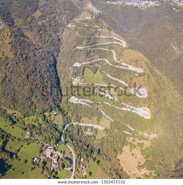 Drone aerial view of the mountain road in Italy.\
Bends creating beautiful\
shapes