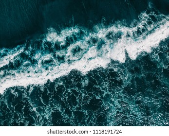 Drone aerial view ocean waves. Blue water background