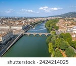 The drone aerial view of Po River and Turin city, Italy. The Po is the longest river in Italy.
