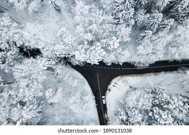 Drone Aerial View Of Road In The Snowy Forest. Vilnius County, Lithuania