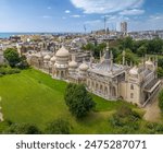 The drone aerial view of The Royal Pavilion.The Royal Pavilion and surrounding gardens, also known as the Brighton Pavilion, is a Grade I listed former royal residence in Brighton, England.