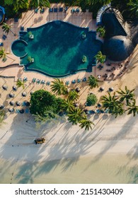 Drone Aerial View Of Tropical Resort , Tropical Resort Aerial Drone View With Pool And Ocean Beach