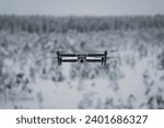 Drone with camera in flight in winter. High quality photo