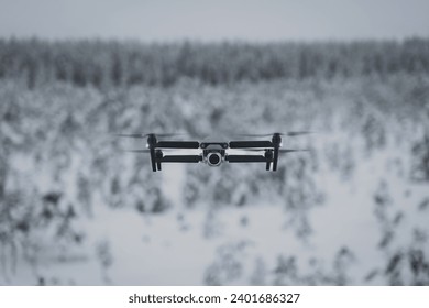 Drone with camera in flight in winter. High quality photo