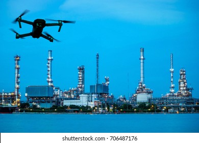 Drone with camera flying on Oil refinery plant site. double exposure