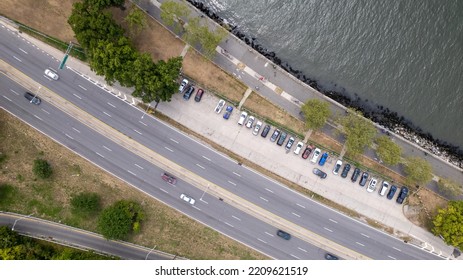 A Drone Camera Point Of View Of The Belt Parkway On A Bright And Sunny Day With Very Little Traffic.