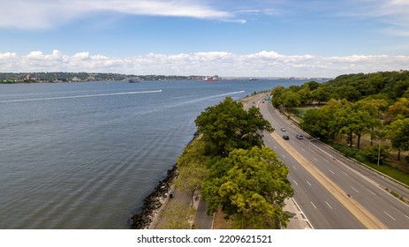 A Drone Camera Point Of View Of The Belt Parkway On A Bright And Sunny Day With Very Little Traffic.