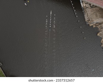 A drone captured this top-down image of a single 8+ rowing boat in perfect synchronised motion while the bright white oars stood out against the dark waters.