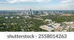 Drone captures stunning aerial view downtown Austin, Texas skyscrapers amidst lush greenery