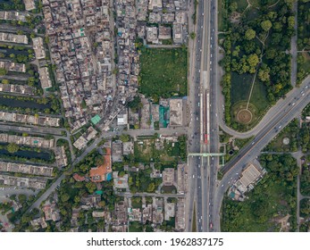 Drone Cityscape Of Lahore Metro Bus Ferozpur Road With Traffic, Buildings And Parks