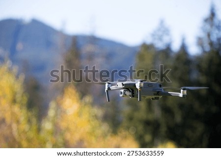 The drone copter flying with digital camera.
