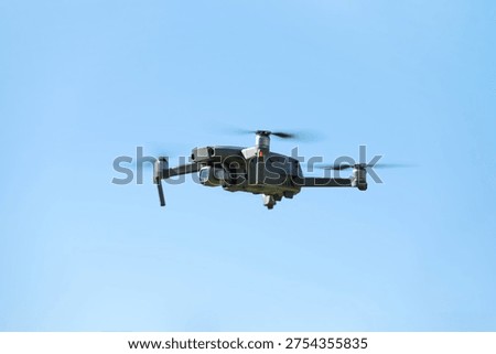 The drone copter flying with digital camera.