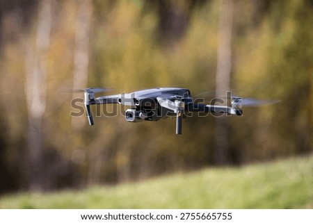 The drone copter flying with digital camera.