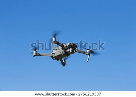 The drone copter flying with digital camera.
