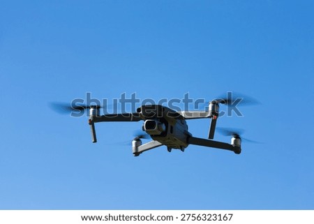 The drone copter flying with digital camera.