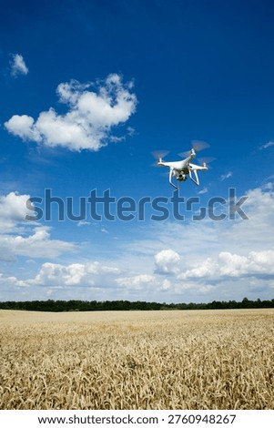 The drone copter flying with digital camera.