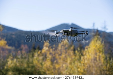 The drone copter flying with digital camera.