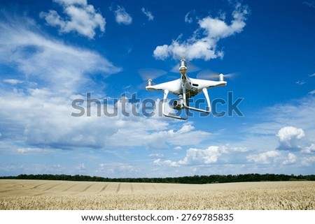 The drone copter flying with digital camera.