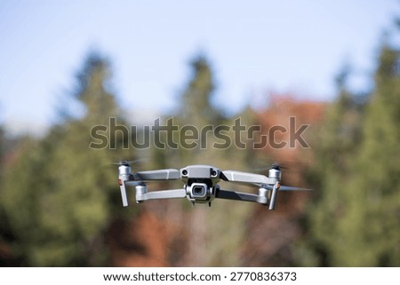 The drone copter flying with digital camera.