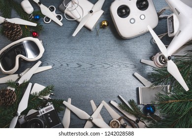 Drone equipment, control panel on the background of a dark wooden table. Aerial shooting concept. best christmas gifts, new year present. copy space, spinner, ski goggles mask