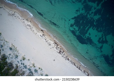 Drone Field Of View Of Of Footprints In The Sand And Water From Above Beach  In Western Australia.