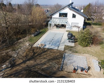 Drone Flight Over A Covered Pool With A Tarp That Is Still Under Construction In A Garden