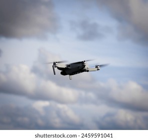 Drone in flight with the sky in the background.