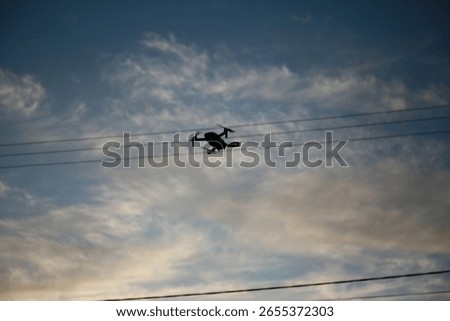 Drone fly above in the sky with clouds