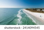 Drone Fly view over beach in Siesta Key,  Florida. Beautiful Siesta Key beach on a sunny day. Turquoise transparent water and blue sea in Siesta Key beach.