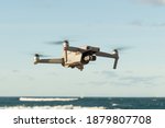 Drone flying on blue sky and sea background