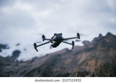 Drone flying on high altitude mountain top - Powered by Shutterstock