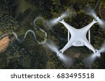 Drone flying over landscape.