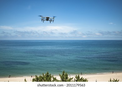 A drone is flying in the sky.