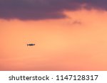 Drone flying in sunset