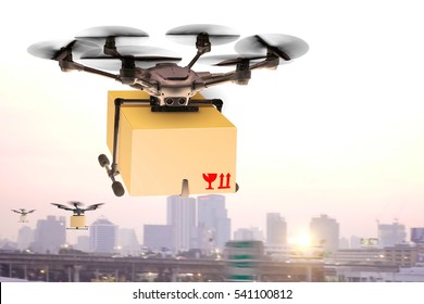 Drone Flying Through The Air With A Delivery Box Package Clamped On To Deliver To Customer  Parcel With Wings Flies In Sky Among Clouds.