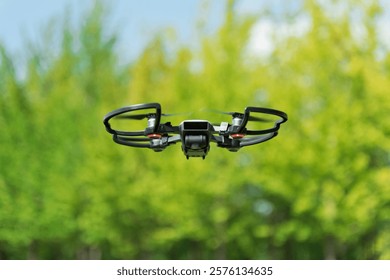 Drone flying under blue sky