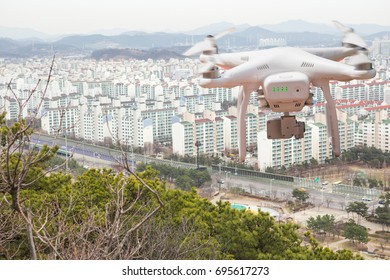 Drone with high resolution digital camera in flight over the city